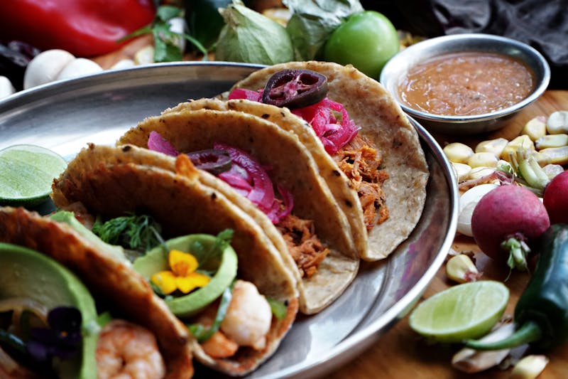 Shrimp tacos with fresh toppings and lime